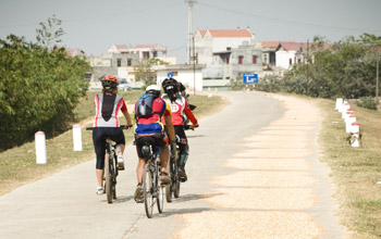 Biking along Red River Bank, North Vietnam